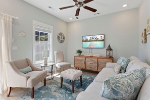 Relax in the spacious Living Area with a Flatscreen TV and plenty of comfortable furniture that makes every night movie night!