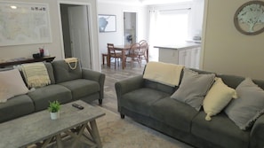 Living room with Master bedroom and kitchen view