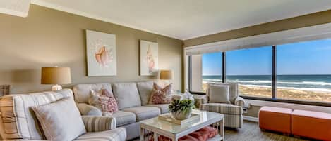 Stylishly Decorated Living and Dining Area with Breathtaking Oceanfront Views