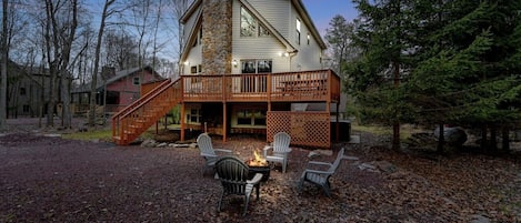 House angle view with 8 chairs firepit