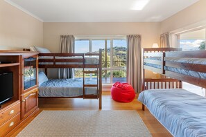 Bunk room with electric heater, pedestal fan, TV, DVD, games. 