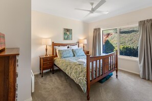 Queen bed with wardrobe, heater and fan. 
