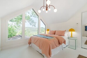 Upstairs bedroom with a Queen bed, closet, and views for miles.