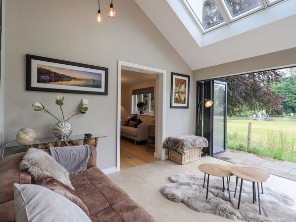 Garden room with double bi-folding doors to patio