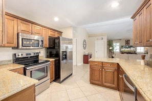 Open Kitchen with Stainless Applicances