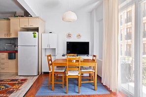 Living room with dining area and open kitchen