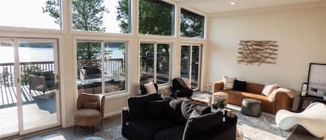 Sunken living room with dramatic views of the lake.