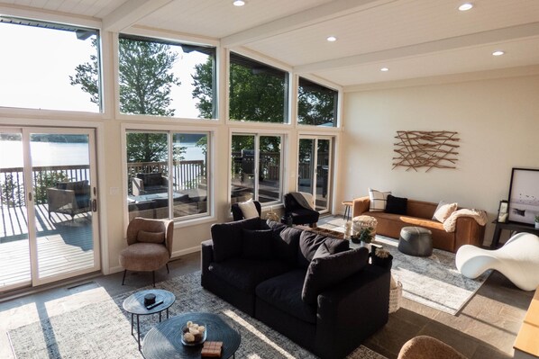 Sunken living room with dramatic views of the lake.