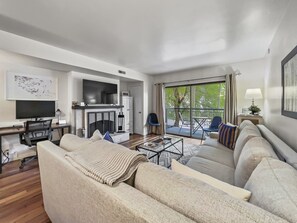 Cozy and Relaxing Living Room with Wood burning Fireplace and TV