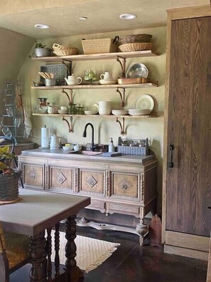 The reclaimed buffet makes this kitchenette feel like the Shire.