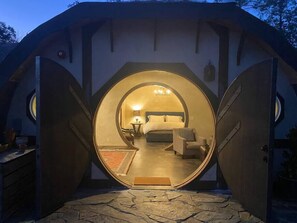 Welcome to your hobbit hole! Unfortunately, fire code didn't allow a single round door.