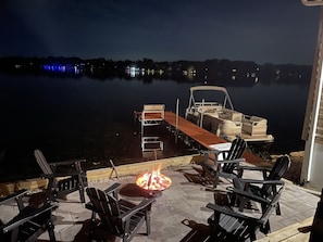 Enjoy conversations by firepit and the water.
