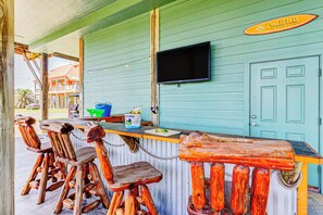 Spacious outdoor bar and 55" TV!