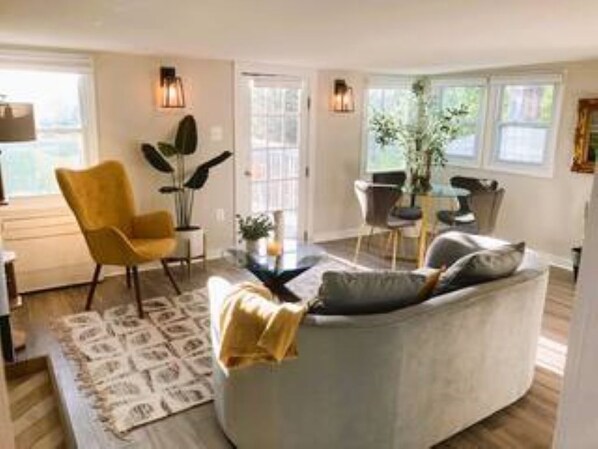 Living area opens onto a private deck.