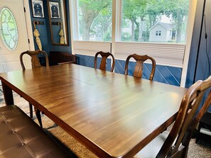 Dining, with front door and front windows.