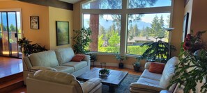 New leather furniture in living room overlooking Lake Okanagan