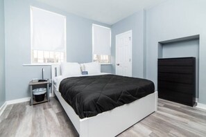 Master Bed, Queen, with ROKU TV on wall 