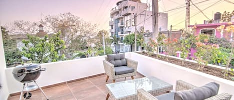 Private balcony with sunset views and Weber grill