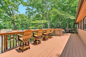 Broad deck featuring extensive seating, providing an ideal spot for socializing and savoring the open air.