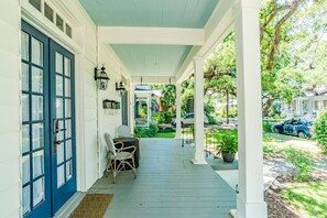 Gorgeous Front Porch with a haint blue ceiling!  Doesn't get much more southern