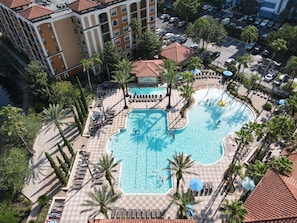 Escape to serenity: immerse yourself in the crystal-clear waters of our resort pool, surrounded by lush greenery