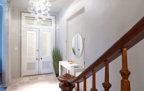 Gorgeous Foyer with double glass doors 10 feet tall original to the home!