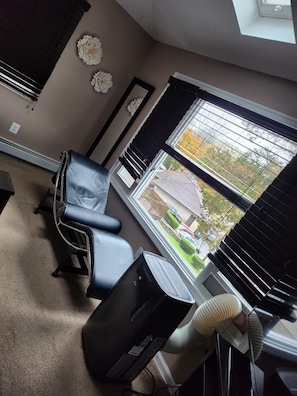 Main bedroom with full length mirror and TV, A/C & Chase 