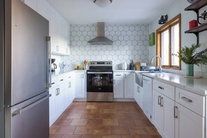 Modern kitchen with stainless steel apron sink