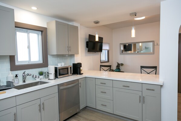 Bright open concept unit with space to hang out with friends