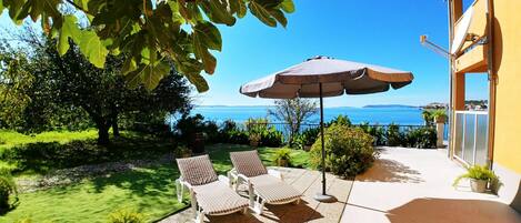 Terrace with sun loungers & parasol