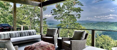 Covered Deck Overlooks Gorgeous Lake and Mountain Views