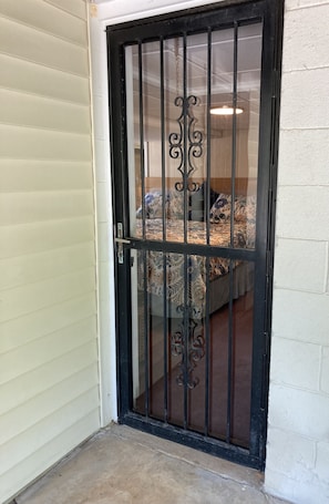 The entry door to the apartment located at the back of the house.