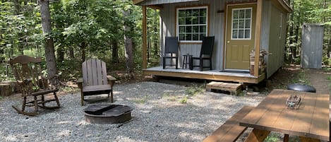 One bedroom cabin nestled on wooded private acre.