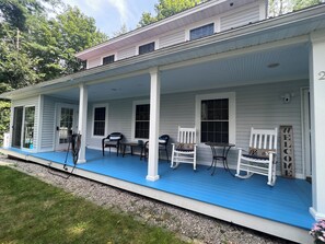 Large farmer’s porch with rockers and additional seating 