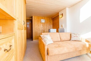 Sink into the cozy sofa after a day exploring the area.