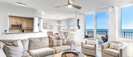 Gorgeous Oceanfront Views from  this Sun-filled Living Space with Comfortable Seating and Flat Screen Smart TV