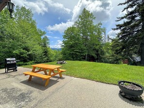 Outside, enjoy peaceful evenings under the stars at your private fire pit, grill up dinner with mountain views, or simply relax at the picnic table