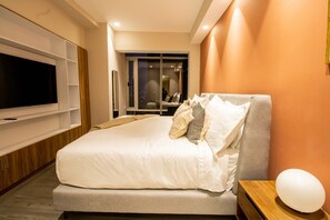 Relax and unwind in our cozy bedroom, featuring a comfortable  bed and plenty of natural light.
