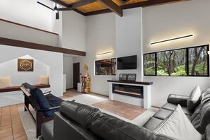 Living room | L shaped couch | Futon couch | 60" fireplace