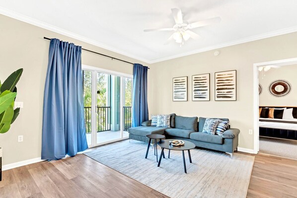 Living room with smart TV and direct patio access