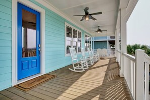 Large rocking chair front porch for a relaxing time.