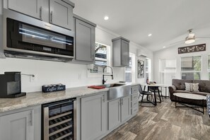 Wine fridge in the modern kitchenette.