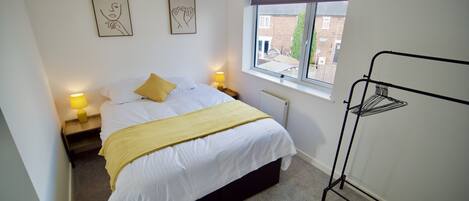 King bed with fresh crisp linen and towels 