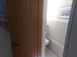 Separate cloakroom off the entrance hall
