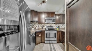 Featuring stainless steel appliances and plenty of counter space.