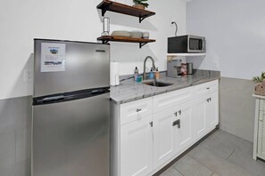 Fully equipped with modern appliances and plenty of counter space.