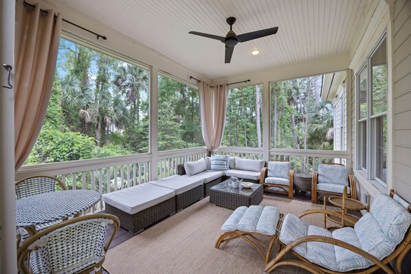 Relax with a good book on the screened porch