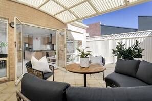 Courtyard - rear undercover alfresco area with BBQ and outdoor seating