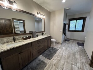 Spacious master bath with walk in shower, tub, closet space