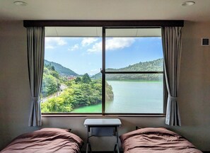 A room with a lake view and a sense of openness